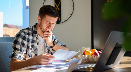 man organizing papers